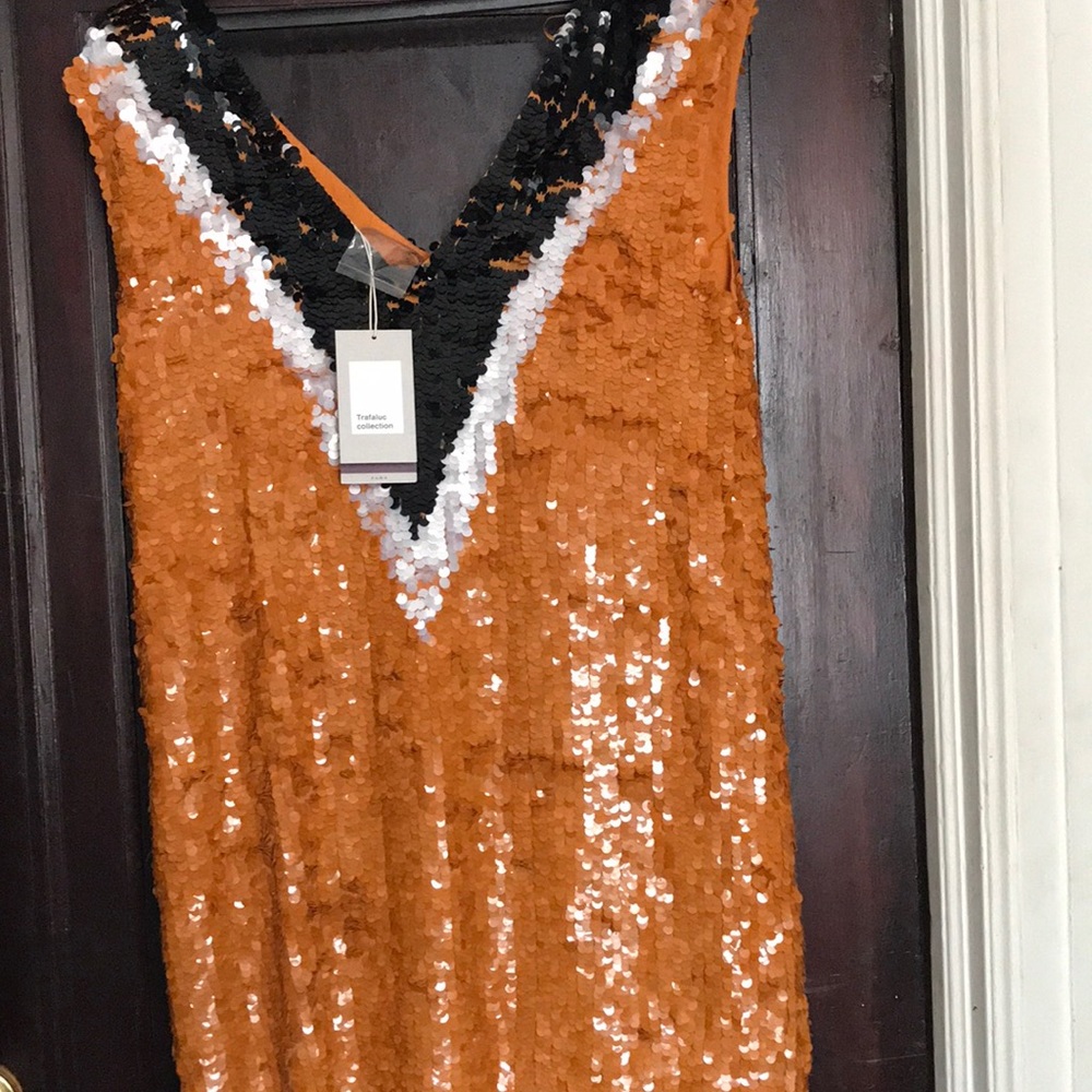 15. New with tags, sequined mini dress.